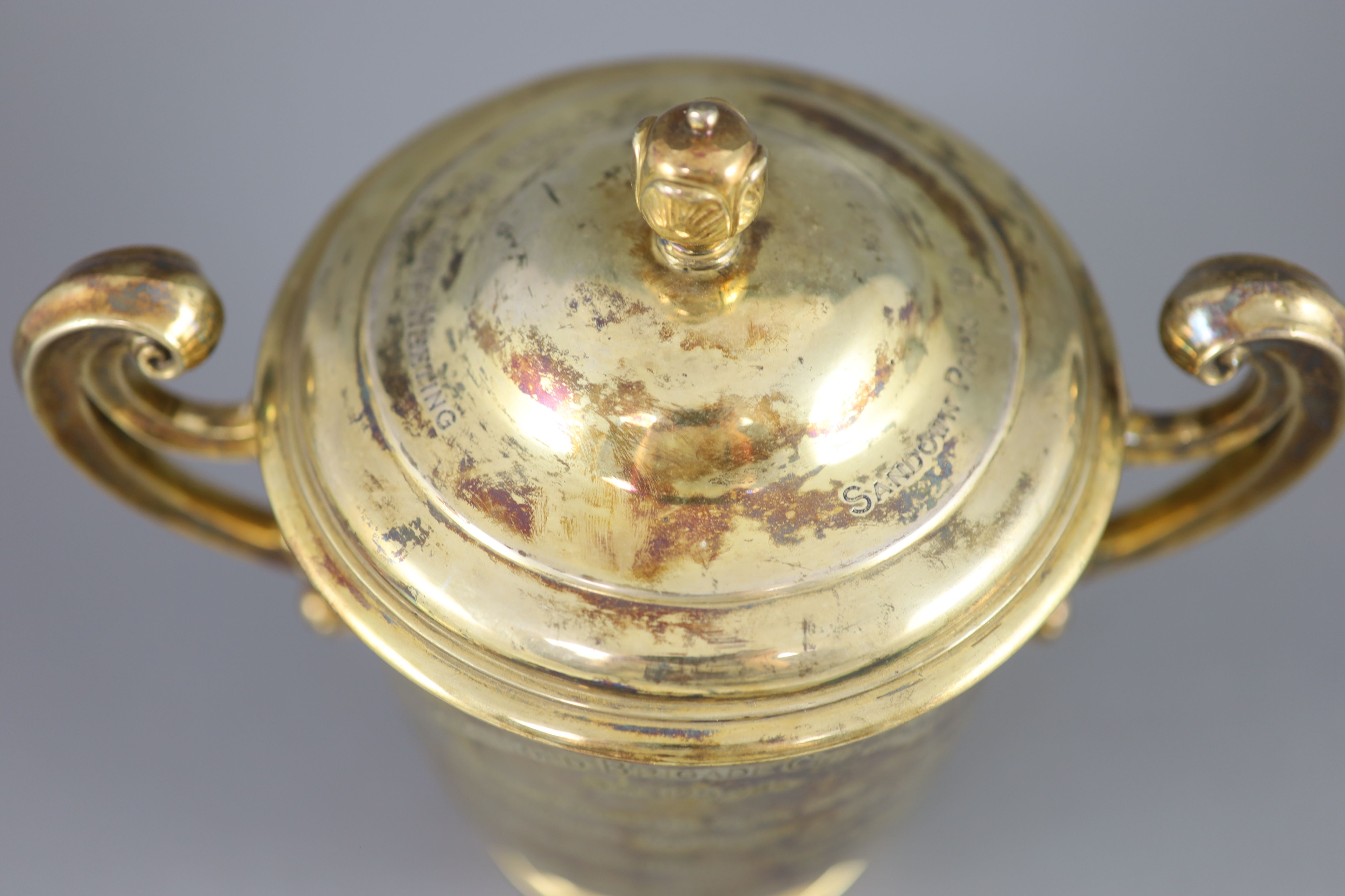 An Edwardian silver gilt-lidded two handled presentation cup and cover, by R & S Garrard and Co.